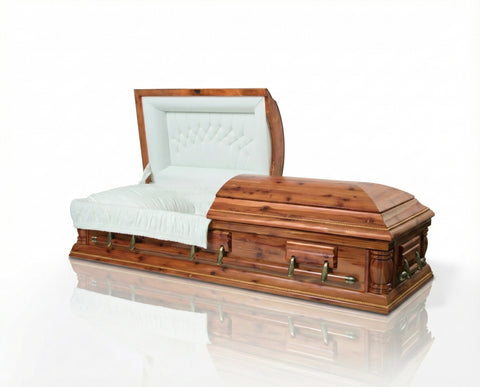 Cedar wood casket with white interior on a reflective surface