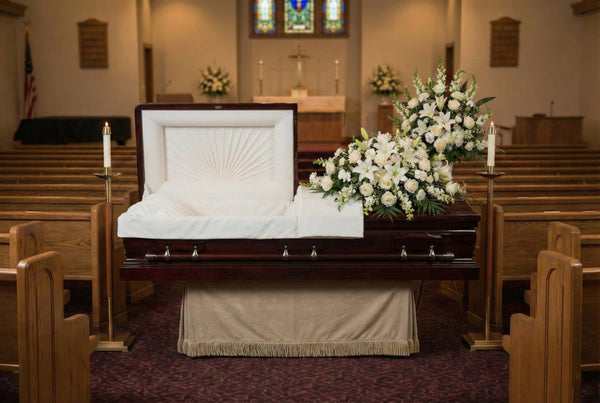 Kingsburg Mahogany casket with floral arrangements in a church setting