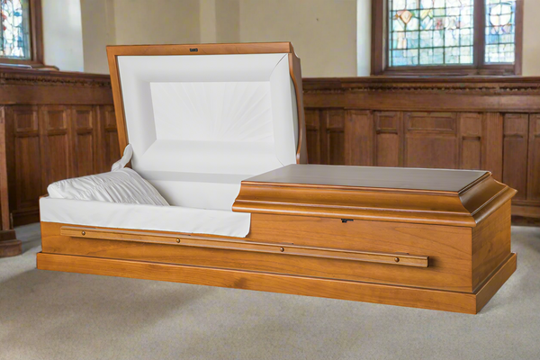 A Casket Depot Vancouver Patriot Casket displayed in a church chapel for a funeral ceremony