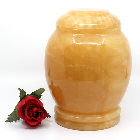 yellow marble urn with round lid