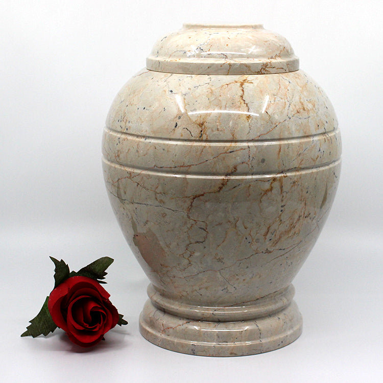 Round botticino urn. 