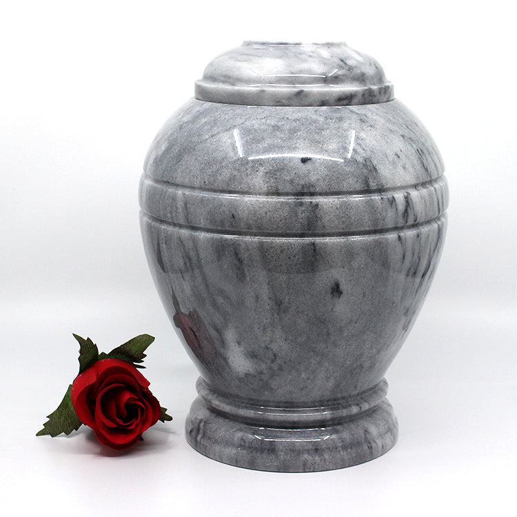 Round marble urn with cloud grey texture 