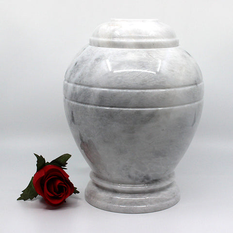 Round marble urn made from white marble